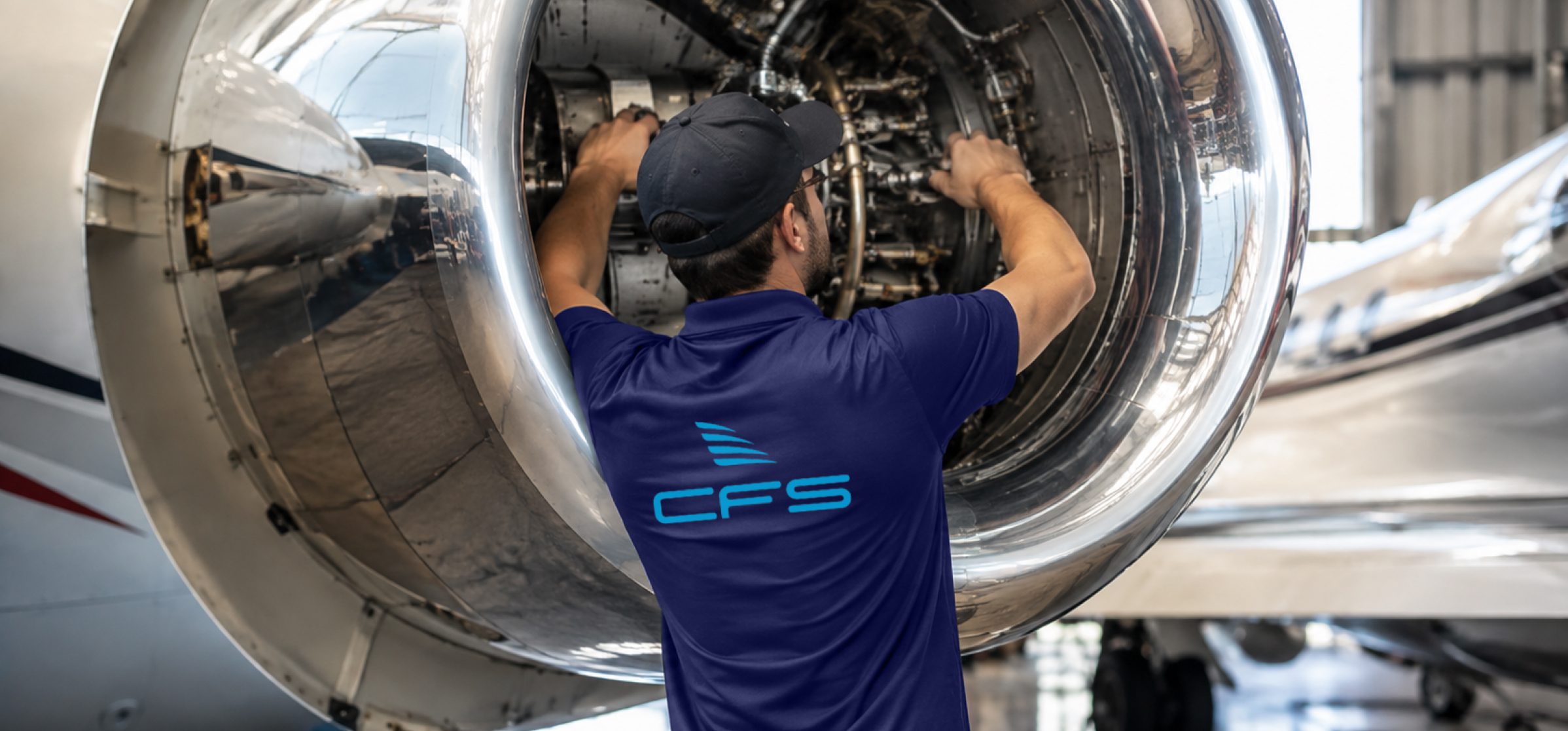 CFS engineer inspecting a jet engine