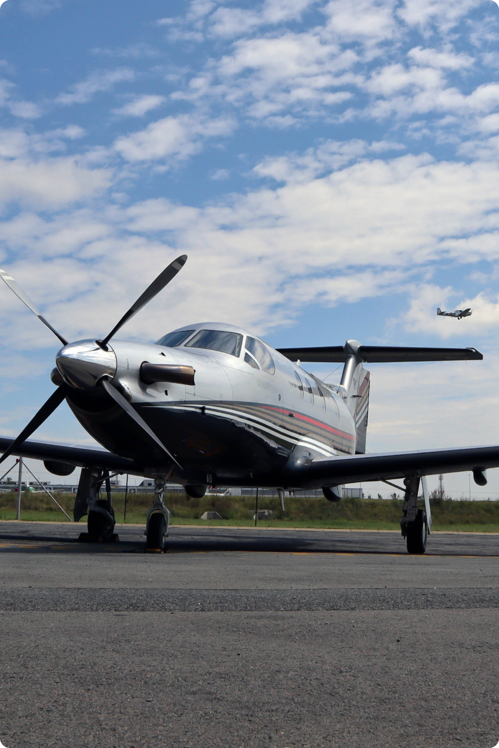 Turboprop on the apron under a blue sky
